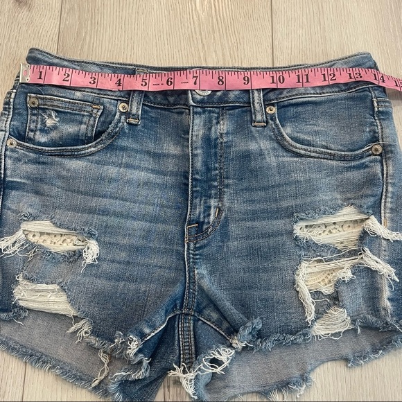 AMERICAN EAGLE Next Level Stretch Hi-Rise Shortie Distressed Blue Jean Shorts - Picture 3 of 9